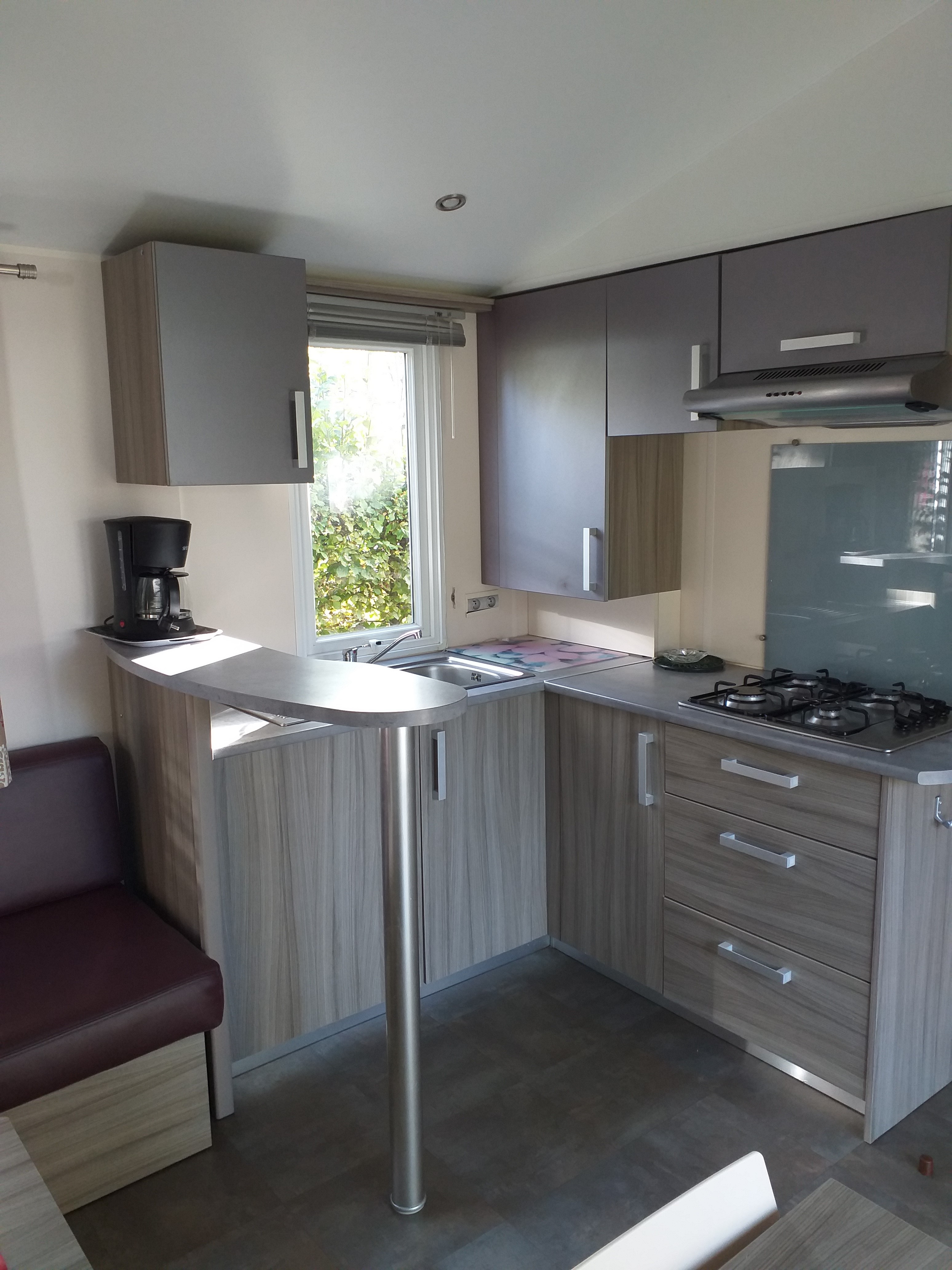 Kitchen of the cottage Baobab in Camping la forêt à Jumièges in Normandy near Rouen